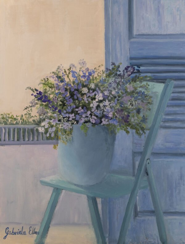 Light blue chair with a large flower pot filled with purple and white flowers.