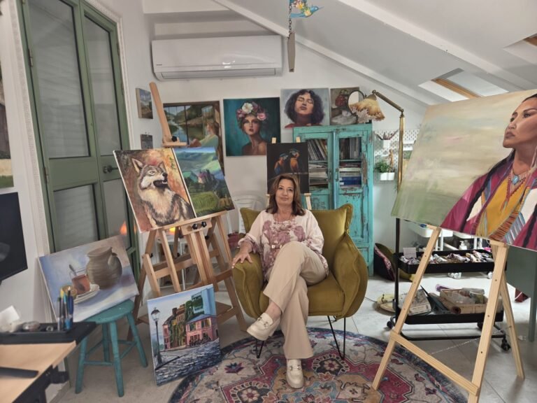 Artist in Studio with Paintings